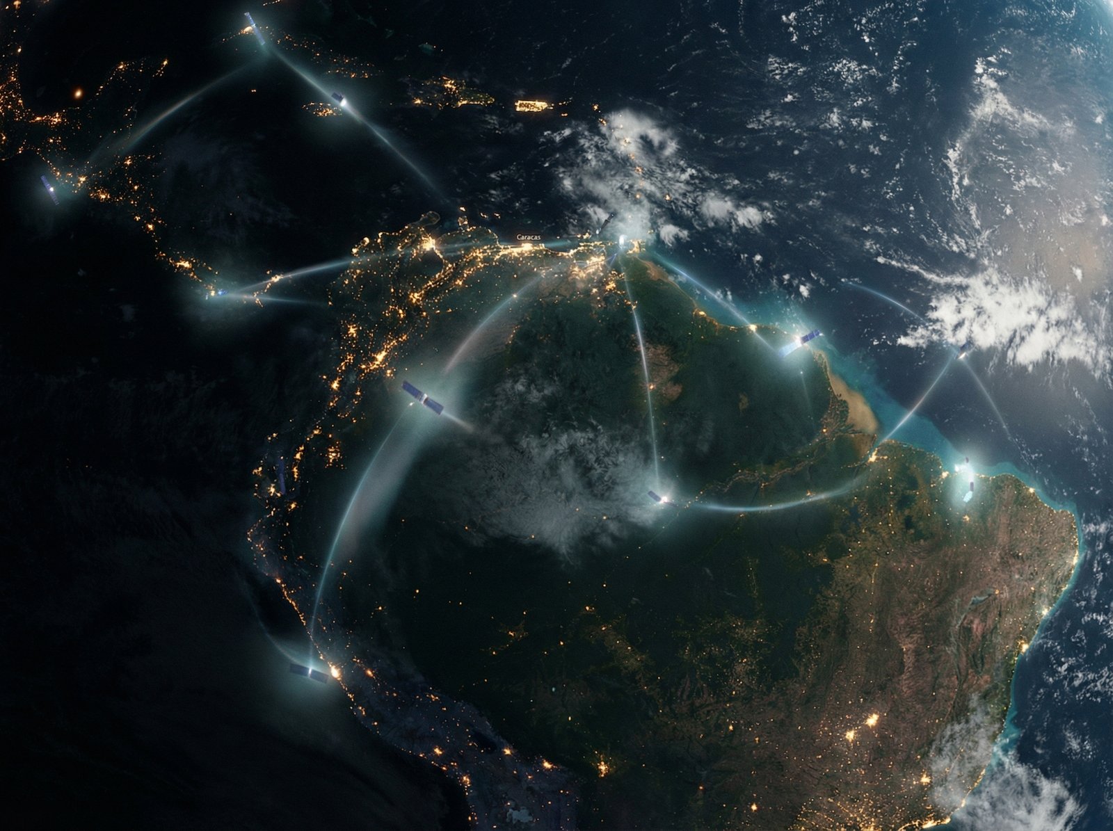 A cinematic high-angle view of Earth from space focusing on the South American continent and Venezuela. Several glowing Starlink satellites are visible in low Earth orbit, casting a soft light over the region. High contrast, modern aesthetic, 4:3 ratio, no text.