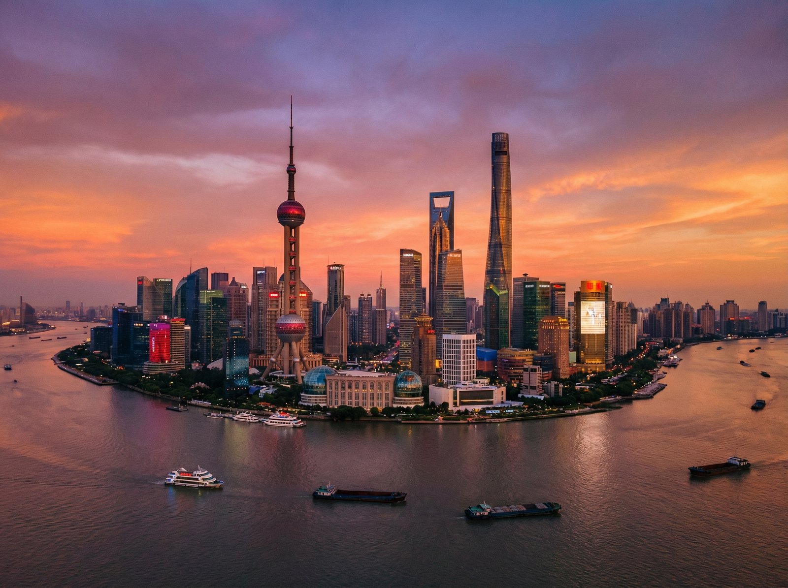 Panoramic view of Shanghai Pudong skyline from the Huangpu River, sunset lighting, modern skyscrapers, bustling city atmosphere, 4:3, no text, high quality photography.