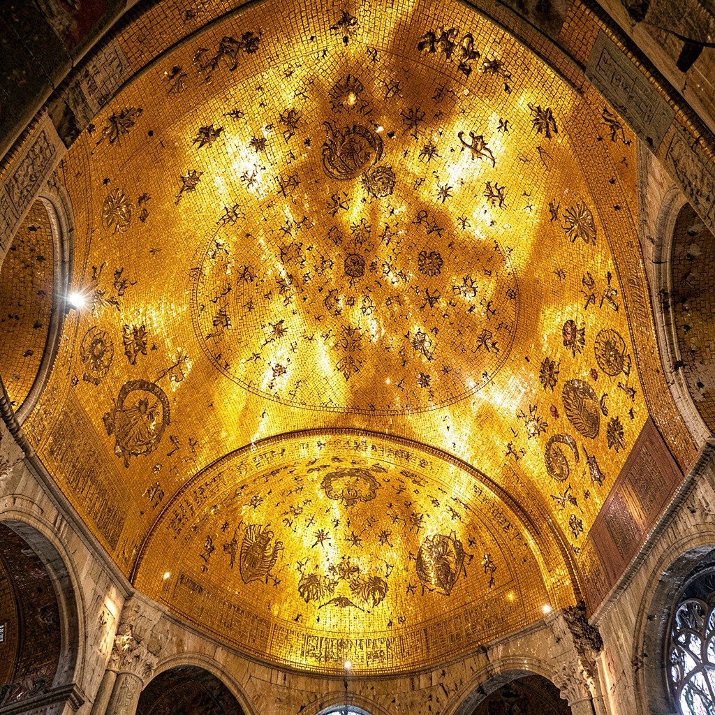 Intricate golden mosaic artwork on the interior curved ceiling of an ancient Eastern Orthodox cathedral, bright warm lighting highlighting the gold tiles, no visible text, historical cultural interior photography, aspect ratio 1:1